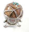 Enamel jewelry box motif an egg shape and green flower inlaid with white pearl beads line decor, enamel in brown color