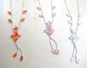 Assorted fashion necklace with 2 diamond and 2 pear shape forming a flower pendant holding 4 leafs on the chain, also double chain hanging a leaf on the bottom