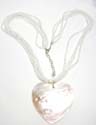 Assorted multi bead strings necklace with a heart shape seashell pendant