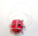 Fashion toe ring motif a red bug design in clear band with black pot color inlaid