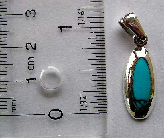 Sterling silver pendant with a genuine elliptical shape blue turquoise stone