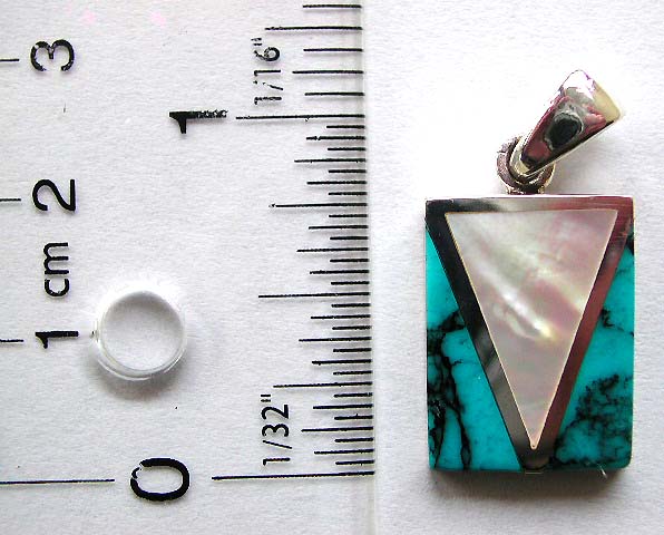 Sterling silver pendant with mother of pearl seashell in middle and a turquoise stone on each side