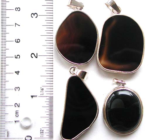Sterling silver pendant with assorted geometrical design black agate stone