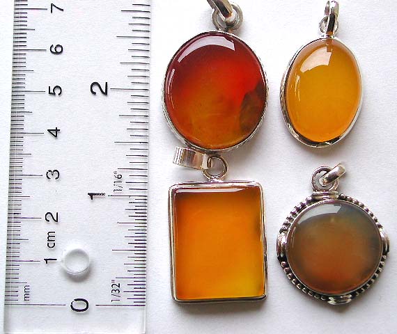 Sterling silver pendant with assorted geometrical design yellow-orange agate stone