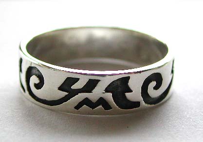 Sterling silver ring with carved-in black tattoo pattern