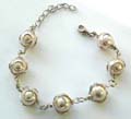 Fashion bracelet with multi wired-in pearl shape ceramic beads inlaid