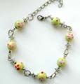 Fashion bracelet with multi red color decor, yellow pearl shape ceramic beads inlaid