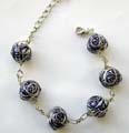 Fashion bracelet with multi wired-in blue and white color, pearl shape ceramic beads inlaid