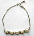 Fashion bracelet with assorted color pearl shape beads and pattern decor at central section