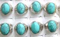 Fashion ring with an large oval shape genuine turquoise stone inlaid at center, pattern decor on each side