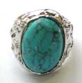 Fashion ring with an  oval shape genuine turquoise stone inlaid at center, pattern decor on each side