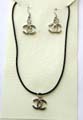 Fashion necklace and earring set in black rubber cord with double cross C shape pendant design