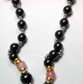 Hematite jewelry, hematite necklace with multi mini pearl magnetic beads forming top section, and double mini silvery beads sectioning, larger pearl magnetic beads and 2 pink cat eye beads inlaid at center