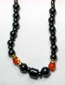 Hematite jewelry, hematite necklace with multi mini cylinder shape magnetic beads forming top section, and mini flat-disk beads sectioning, larger pearl magnetic beads and 2 orange cat eye beads inlaid at center 