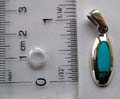 Sterling silver pendant with a genuine elliptical shape blue turquoise stone inlaid 