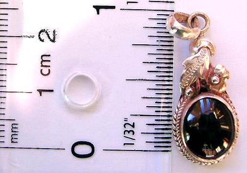 Sterling silver pendant with an oval shape amethyst stone at center and flower leaf pattern decor on top    
