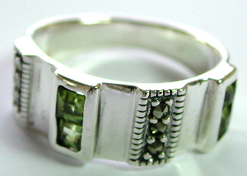 Central widen sterling silver ring with 2 rows dotted marcasite stone and 2 rows green cz stone