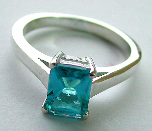 Sterling silver ring with a rectangular blue / clear cz stone