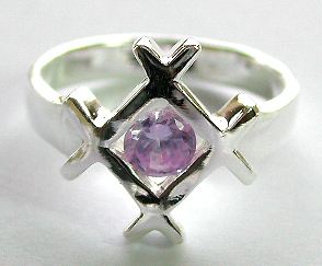 Sterling silver ring with a rounded light / dark purple cz stone