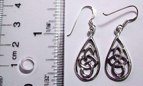 Sterling silver earring in water-drop shape pattern design with carved-out Celtic knot work decor at center        
