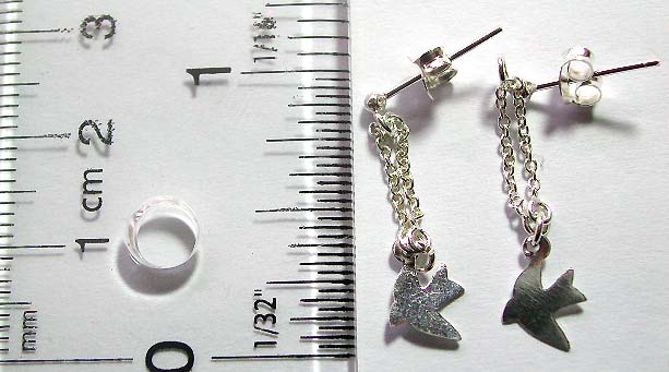 Sterling silver stud earring with mini chain loop holding a fish pattern on bottom        