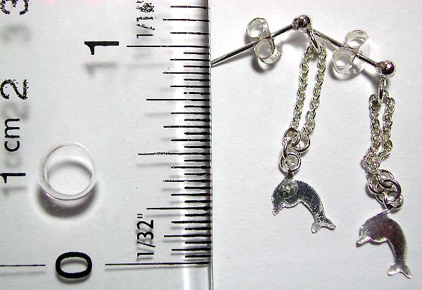 Stud earring in stamped 925. sterling silver setting with mini chain loop holding a dolphin pattern on bottom        