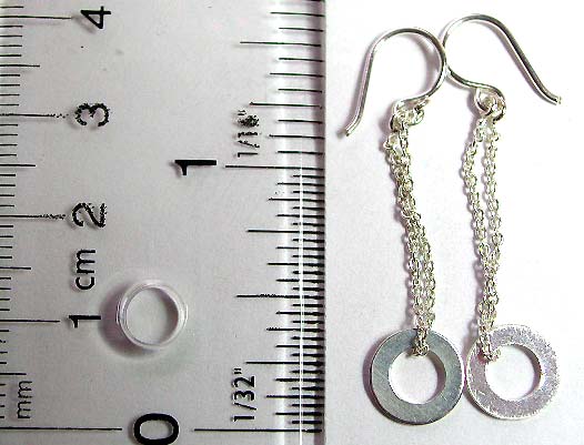 Sterling silver earring with chain loop holding a circle pattern on bottom        