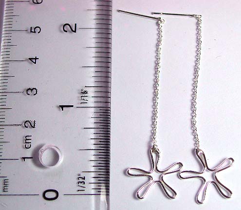 Sterling silver stud earring with long chain holding a carved-out flower pattern on bottom        