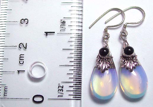 Sterling silver earring with floral pattern design on top and imitation moon stone on bottom