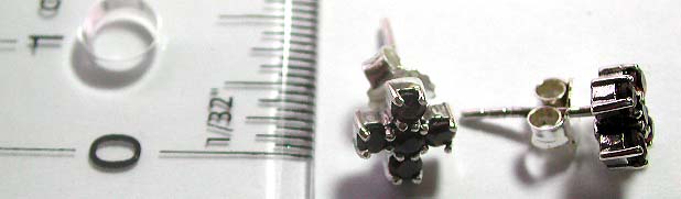 Stud earring made of solid 925. sterling silver in 5 mini garnet stone forming flower