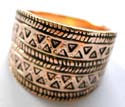 Pure bronze ring with central widen design and carved-in double wave line pattern decor at center