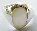 Sterling silver ring with an ellicptical shape white mother of pearl seashell stone embedded at center