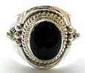 Sterling silver ring with dotted double mini loop pattern holding a black onyx stone at center, Bali beadded pattern decor on each side