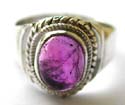 Sterling silver ring with double mini loop pattern holding a genuine oval shape amethyst stone at center