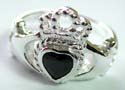 Sterling silver ring with hand holding heart shape black onyx stone at center