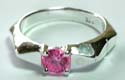 Carved-in triangle central design sterling silver ring with a rounded pinkish cz stone inlay at center