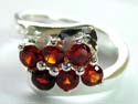 Think band sterling silver ring with 2 rows of 3 pics rounded red cz stones embeded at center