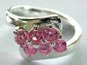Think band sterling silver ring with 2 rows of 3 pics rounded pinkish cz stones embeded at center
