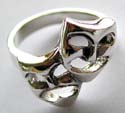 Sterlin silver ring with carved-out double face pattern decor at center