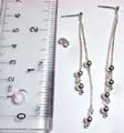 Sterling silver stud earring with double even length round chain holding double spinning beads on bottom