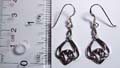 Sterling silver earring in carved-out Celtic floral knot work pattern design, with fish hook for convenience closure