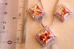 Fashion chain necklace and stud earring set with multi mini clear cz embrassing a diamond shape, orange color cz stone pendant