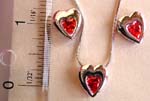 Heart love fashion jewelry set, snake chain necklace holding a garnet cz stone embedded heart love pendant at center, same design stud earring