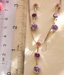 Necklace and earring set with snake chain necklace holding 1 rounded orange and 2 purple cz on strip pendant, with pair of same design stud earring 