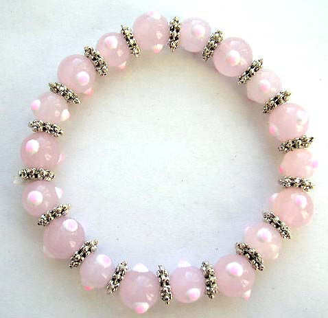 Multi light pinkish hand-painted lampwork glass beads ( mystical eye handmade beads ) and flat silver beads forming fashion stretch bracelet 


 
 
