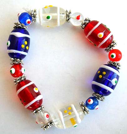 Fashion stretchy bracelet with multi rounded and olive shape eye beads and flat silver beads inlaid           


 
 
