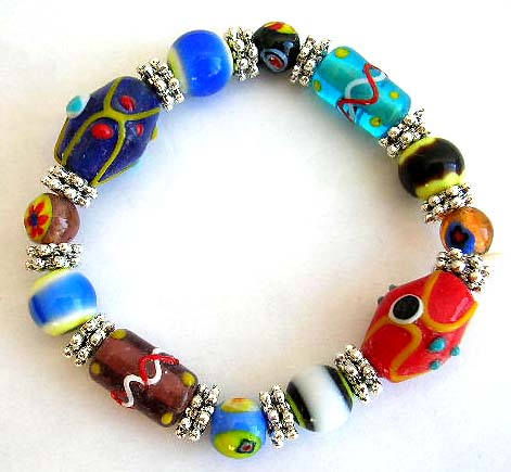 Fashion stretchy bracelet with multi long and rounded eye beads and flat silver beads inlaid            


 
 
