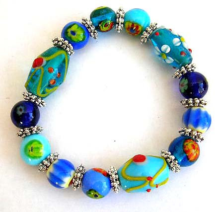 Fashion stretch bracelet with multi long and rounded eye beads and flat silver beads inlaid             


 
 
