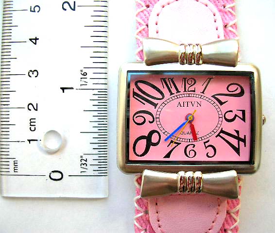 Fashion watch with rectamgular clock face design and metal sun shine pattern
