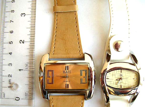 Fashion watch in fat rectangular or elliptical clock face design with or without button on imitation leather band decor